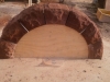 Curved sandstone arch over a window