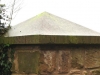 Sandstone pier cap on a brick pillar
