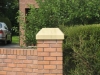Red sandstone pier cap with a weathered top