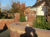 Hand-made sandstone copings on a garden wall