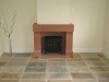 Sandstone fireplace with a carved lintel