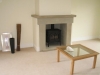 Sandstone fire surround with a chamfered jamb