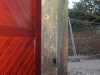 Red sandstone gateposts at a driveway entrance