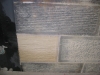 Mason hand-tooling a sandstone block
