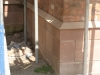 Red sandstone plinth course by JB Stone