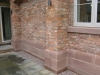 Red sandstone plinth on a period property
