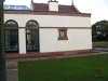 Chamfered sandstone plinth course