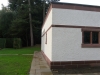 Red sandstone plinth course by JB Stone