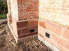 Sandstone plinth course with a moulded top
