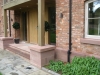 Red sandstone staddle stone with a chamfered cap for an oak post