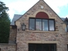 Red sandstone window surround by JB Stone