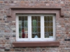 Hand-made sandstone door surround with carved corbels