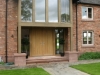 Hand-made sandstone door surround with carved corbels